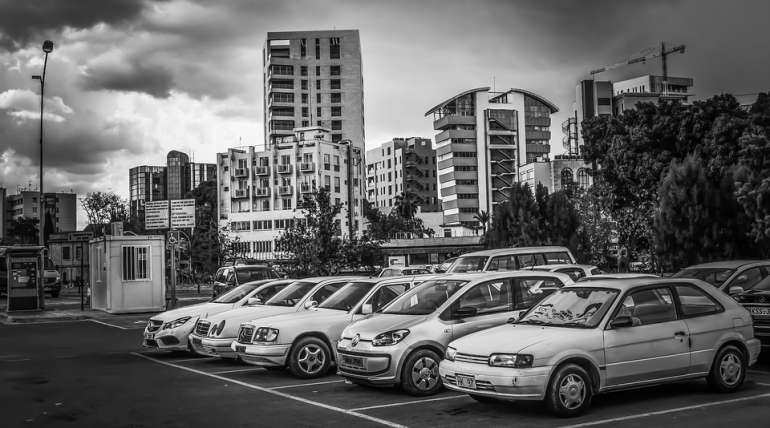 Car In A Parking Lot Back and White | Alpha Airport Parking