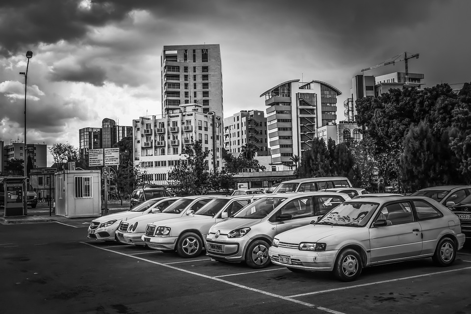 Car In A Parking Lot Back and White | Alpha Airport Parking